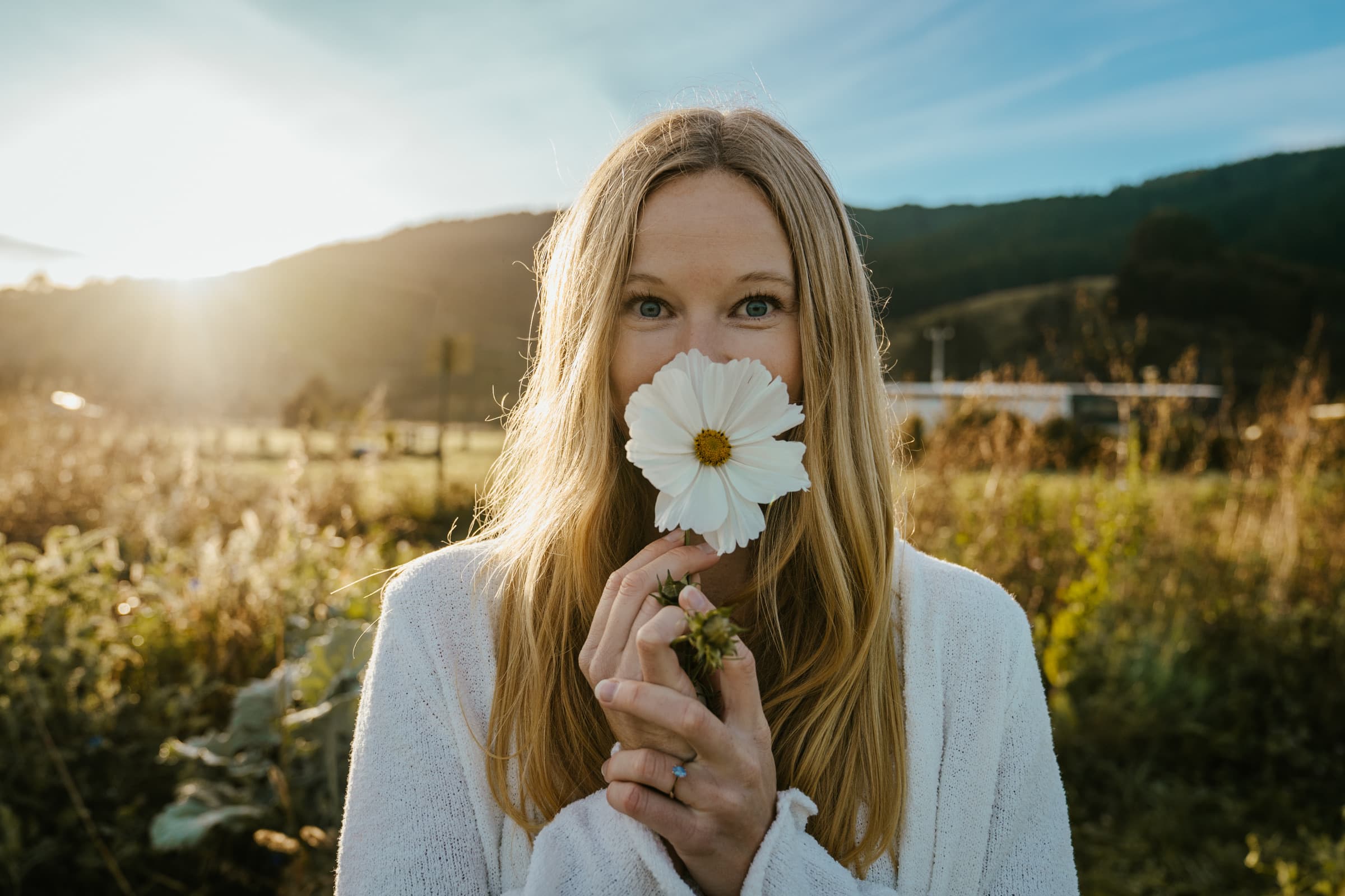Amy Lewis holding a flower